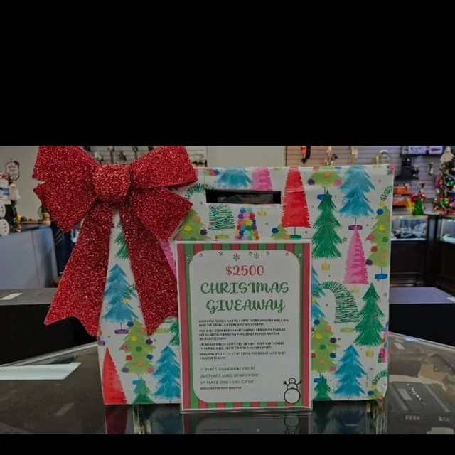 A gift-wrapped entry box for our $2,500 Christmas giveaway on the store counter